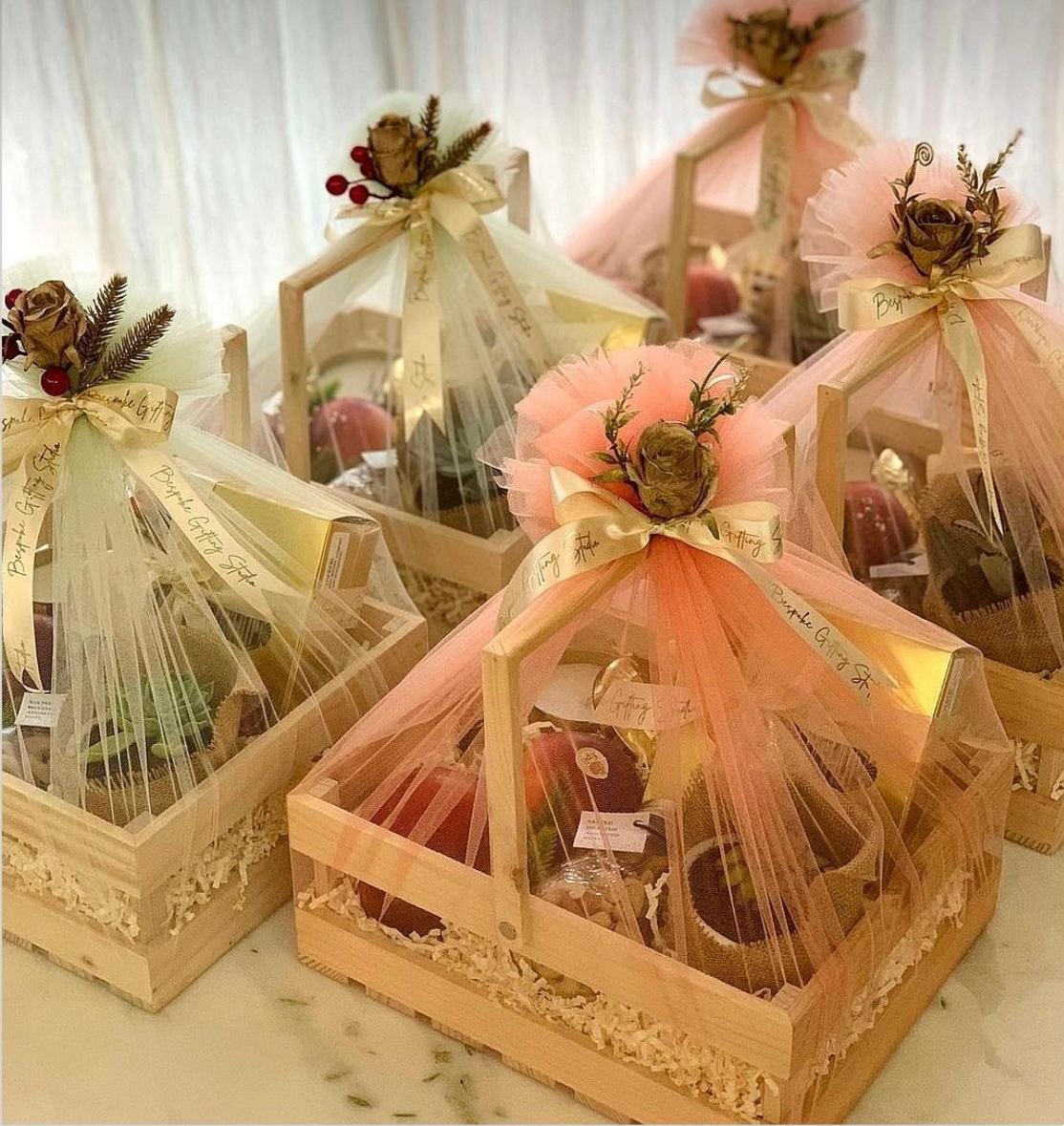 Wooden crates with tulle wrapping and floral accents